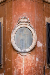 Rustic Mirror on a Building in Italy