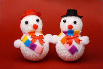 Christmas, New Year's snowman on a red background. Christmas background