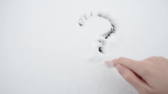 Question mark on white snow. Question. The frozen question. The decision was suspended. The question is stopped and is in limbo because there is no solution