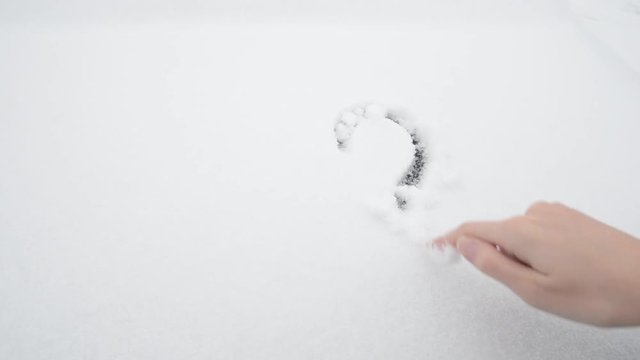 Question mark on white snow. Question. The frozen question. The decision was suspended. The question is stopped and is in limbo because there is no solution
