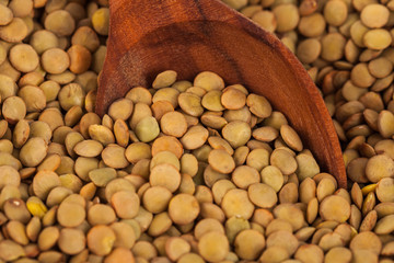 dry lentils on wooden spoon, healthy food