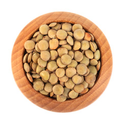 dry lentils on wooden bowl isolated on a white background