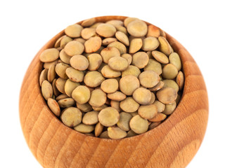 dry lentils on wooden bowl isolated on a white background