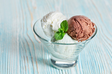 ice cream with mint on blue wooden table