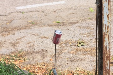 Isolated red can on the street (Pesaro, Italy)