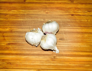 Garlic Cloves on Wooden Board