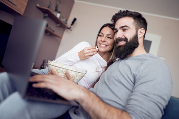 Young couple watching movie