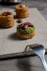 Fresh arabic sweets on light stone background.