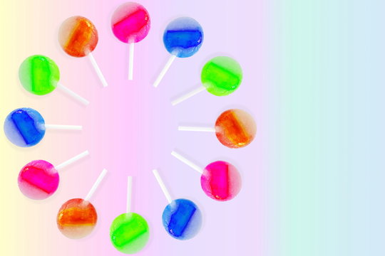 colorful lolypop isolated sweet candy concept rainbow background with copy space