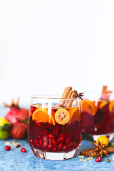 Sangria pomegranate, pear, orange, kumquat and spices, cinnamon, cloves, star anise.