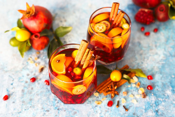 Sangria pomegranate, pear, orange, kumquat and spices, cinnamon, cloves, star anise.