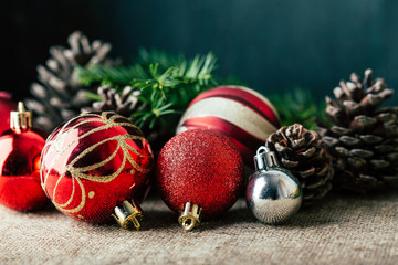 Christmas background, decorations, red balls, cones and fir branches