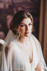 Fototapeta premium Gorgeous bride in a beautiful dress. Morning newlyweds.