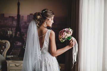 Gorgeous bride in a beautiful dress. Morning newlyweds.