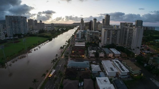 Zoom out sunrise timelapse of the city of Honolulu, Hawaii, USA