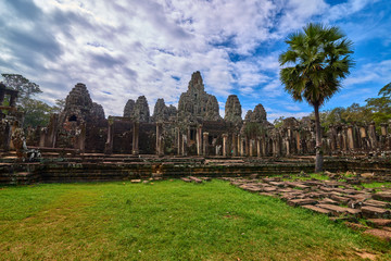 Fototapeta na wymiar The Bayon Prasat Bayon Khmer temple at Angkor Thom is popular tourist attraction, Angkor Wat Archaeological Park in Siem Reap, Cambodia UNESCO World Heritage Site