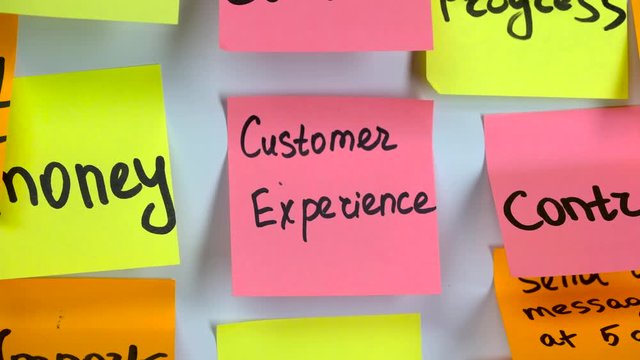 Inscription on the sticker customer experience on a sticker pasted on a board