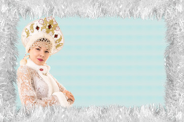 Christmas design-Christmas card with a beautiful, young, smiling woman dressed as Santa Claus,...