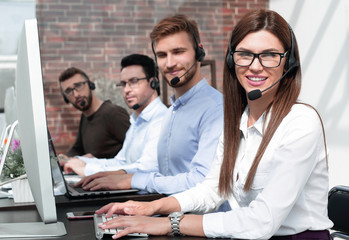 group of call center specialists work with clients