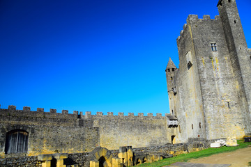 View of the walls, battlements, and defenses of the fortress of Beynac overlooking the Dordogne...