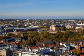 Obraz premium City streets of Germany. Panoramic view of the city of Hamburg from a height. Photo of Hamburg from a height. Cityscape houses and streets.
