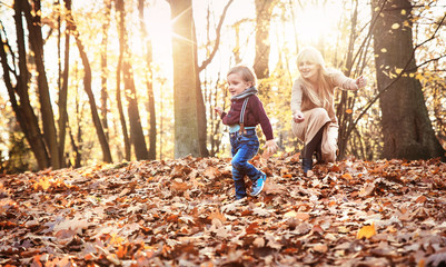 Joyful family enjoying great, autumnal weather