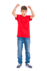 Fototapeta premium Full length portrait of young caucasian teen boy isolated on white background. Victory screaming funny teenager. Handsome winner child with his hands up looking at camera.