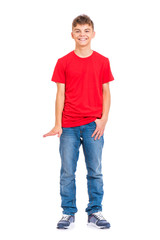 Fototapeta premium Full length portrait of young caucasian teen boy isolated on white background. Funny teenager showing something by hand. Handsome child looking at camera and smiling.