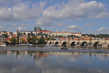 Fototapeta na wymiar Historical center in Prague. Travel to the Czech Republic. Vltava River and Charles Bridge.
