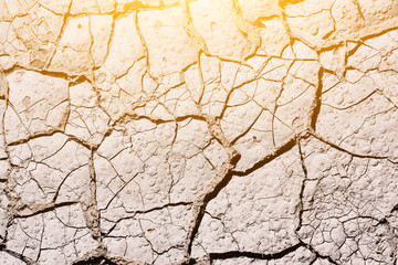 Texture, background of dry cracked earth ground. Global shortage of water on planet. Deep cracks in...