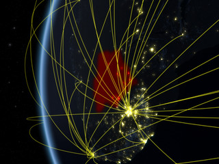 Botswana from space on model of Earth at night with international network. Concept of digital communication or travel.