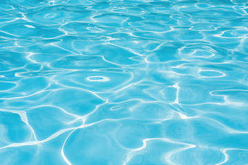 Fototapeta na wymiar Blue water in swimming pool, Ripple wave in pool for background and abstract, Reflection water with shiny in poolside