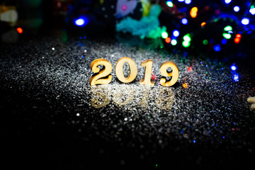Happy New Year 2019 on black crystal background.