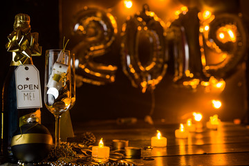 New Years Eve celebration conceptual photo,with two champagne glass, in the background 2019 made with inflatbale ballons.