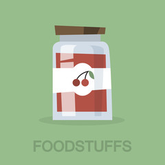 Jam made of cherry in a glass jar.