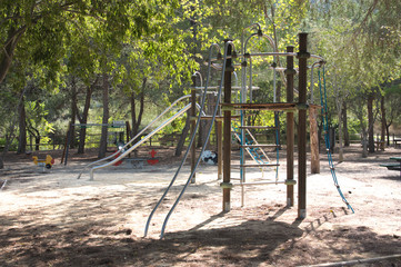 Fototapeta na wymiar Playground in a recreational area in a natural environment