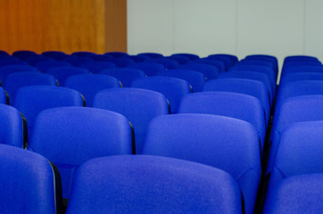 Fototapeta premium Blurry blue emty seats auditorium room