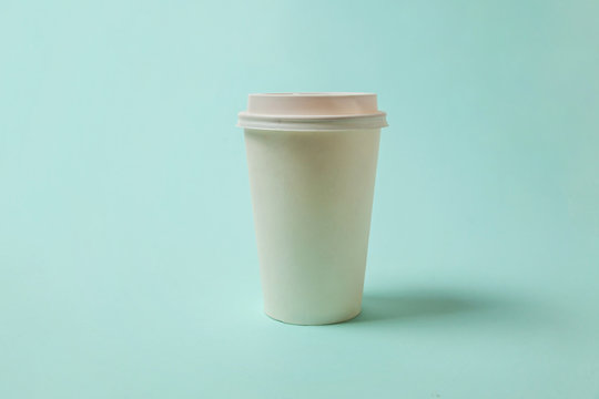 Simply Flat Lay Design Paper Coffee Cup On Blue Pastel Colorful Trendy Background. Takeaway Drink Container. Good Morning Wake Up Awake Concept. Template Of Drink Mockup. Top View Copy Space