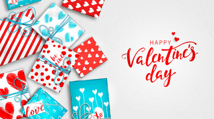Saint Valentine's day background. Gift boxes in wrapping paper with hearts. Red and blue presents box of colorful cardboard tied with twine. Beautiful greeting card, banner on celebration of day love