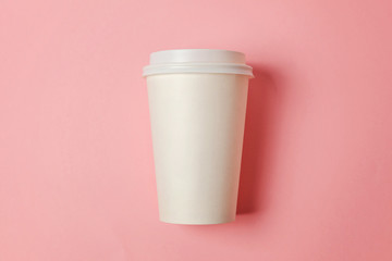 Simply flat lay design paper coffee cup on pink pastel colorful trendy background. Takeaway drink container. Good morning wake up awake concept. Template of drink mockup. Top view copy space