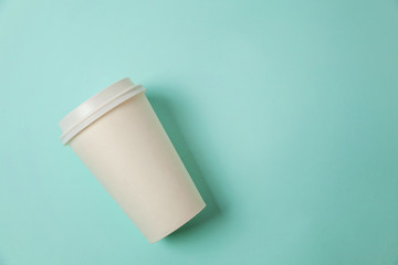 Simply flat lay design paper coffee cup on blue pastel colorful trendy background. Takeaway drink container. Good morning wake up awake concept. Template of drink mockup. Top view copy space
