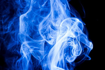 Fototapeta premium Blue smoke on black background