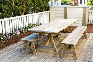 Closeup of empty wooden table, nobody in patio outdoor garden backyard porch of home, wood with...