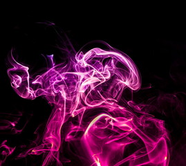 Obraz premium Colored smoke on black background