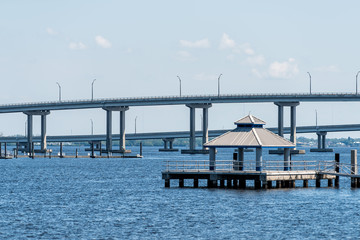 Bridges in marina harbor dock on Caloosahatchee River during sunny day in Florida gulf of mexico coast, pier, nobody, gazebo pavilion in Fort Myers, USA