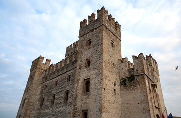Castle in Sirmione. View to the medieval Rocca Scaligera castle in Sirmione town on Garda lake, Italy. Scaliger Castle (13th century) in Sirmione on Garda lake near Verona, Italy