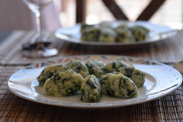 typical original italian dish malfatti dumpling with spinach