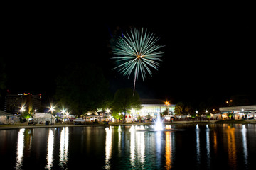 Fireworks at night on the water