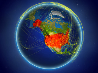 USA from space on planet Earth with digital network representing international communication, technology and travel.