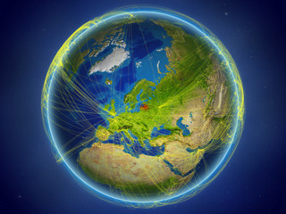 Latvia from space on planet Earth with digital network representing international communication, technology and travel.